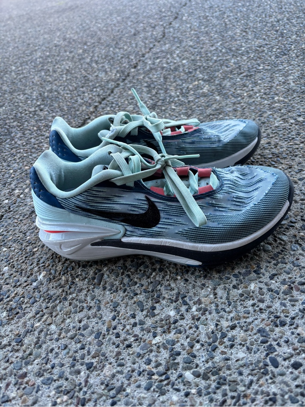 Nike Teal and Black Athletic Running Shoes with Coral Accents